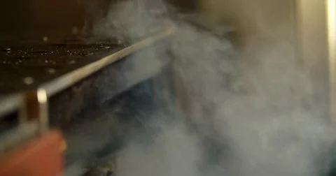 Chef prepares beef steak 4k video: flips meat grill oven. Restaurant BBQ kitchen Stock Footage 70005655