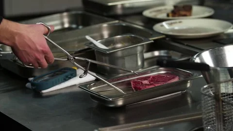Chef prepares beef steak raw slow motion HD video: meat restaurant kitchen Stock Footage 70007467