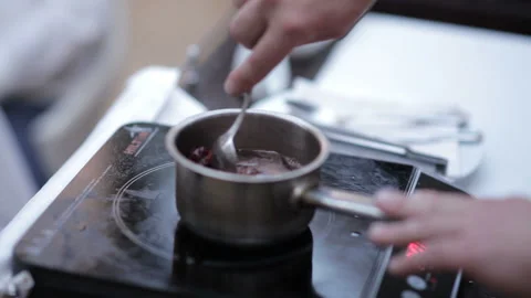 The chef prepares the berry sauce Stock Footage 107489181