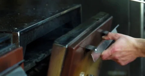 Chef prepares bone steak 4k video: takes meat grill charcoal oven BBQ restaurant Stock Footage 70005822