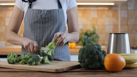 The chef prepares broccoli for fresh green detox food Stock Footage 102617554