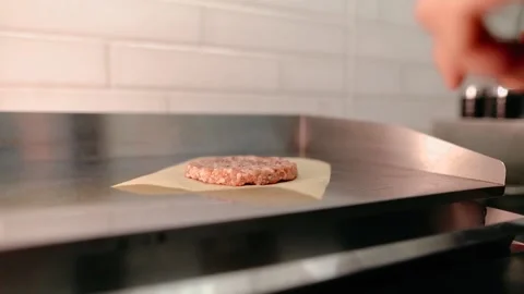 The chef prepares a burger. Beef, pork, cucumber, sauce and onion. Stock Footage 158171979