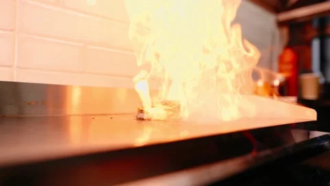 The chef prepares a burger. Beef, pork, cucumber, sauce and onion. Stock Footage 158172017