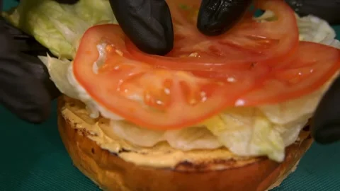 Chef prepares a burger. Slow motion. Stock-Footage 303745971