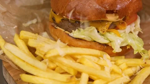 Chef prepares a burger. Slow motion. Stock Footage 303745973