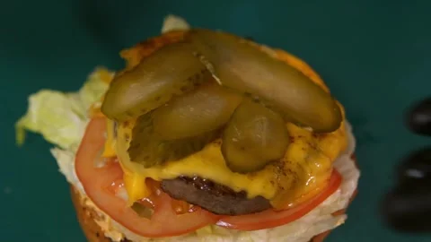 Chef prepares a burger. Slow motion. Video stock 303745974