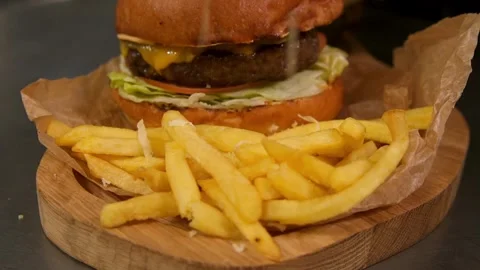 Chef prepares a burger. Slow motion. Stock-Footage 303746165