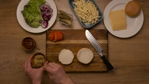 Chef prepares a burger, top plan  Stock Footage 163830257