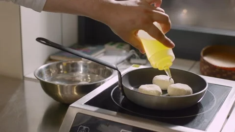 The chef prepares cheese pancakes in the kitchen of the cafe. Stock Footage 277131625