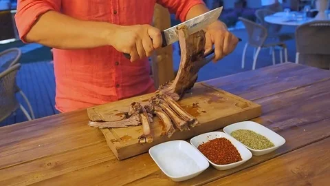 Chef prepares chops for service Stock Footage 102415296