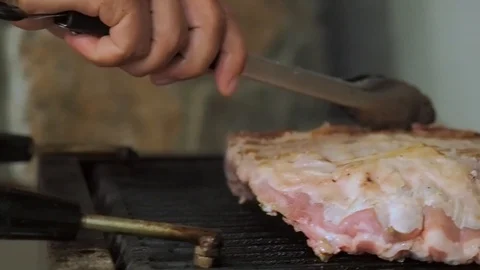 Chef prepares chops for service Stock Footage 102415323