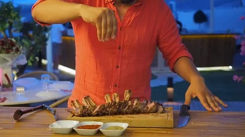 Chef prepares chops for service Stock Footage 102415354