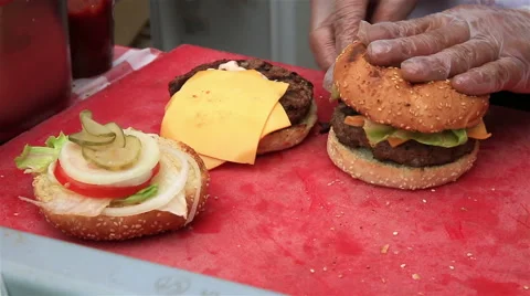 Chef prepares classic cheeseburgers. Stock Footage 50546719