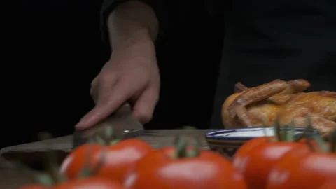 The chef prepares to cut a whole grilled chicken Stock Footage 137812080