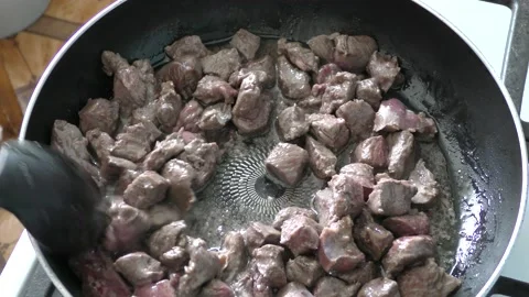 The chef prepares deer meat in a frying pan. healthy food concept Video stock 151018821