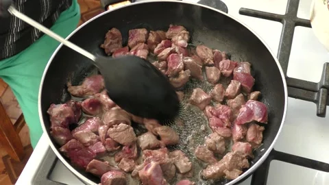 The chef prepares deer meat in a frying pan. healthy food concept Stock Footage 151019203