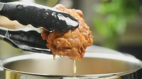 Chef prepares delicious fried chicken. Stock Footage 194921893