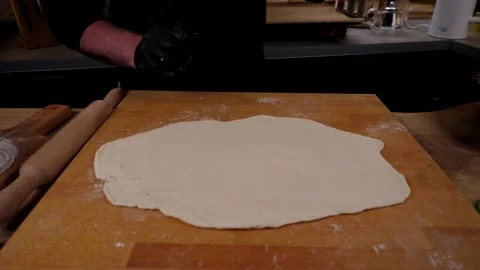 The chef prepares delicious pizza from vegetables, cheese sausage and eggs Stock Footage 137797932