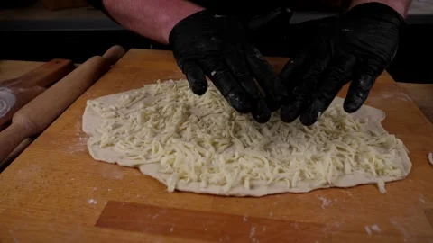 The chef prepares delicious pizza from vegetables, cheese sausage and eggs Stock Footage 137797934