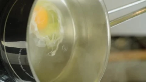 The chef prepares a delicious poached egg. Vertical video. Stock Footage 311046131