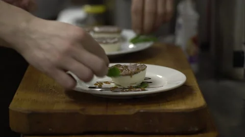 Chef prepares a dessert on restaurant kitchen Stock Footage 61900145