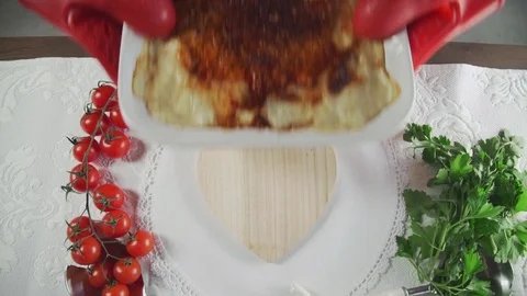 The chef prepares a dish, fish souffle, vegetables and greens, food from the Stock Footage 75706016