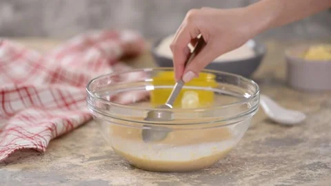 Chef prepares dough for baking. Adding flour in glass bowl. Video stock 131833046