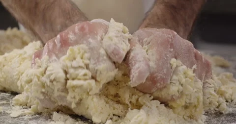 Chef prepares dough, kneading dough with hands. Traditional Italian pasta recipe Stock Footage 270381294