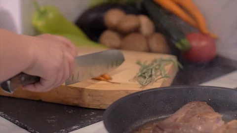 The chef prepares duck breasts with carrots in a pan Video stock 110045811