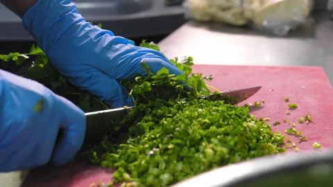 Chef prepares food kitchen restaurant cutting fresh herbs. Video stock 267293023