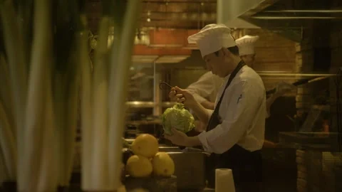 Chef Prepares Fresh Vegetables in Restaurant Kitchen, Beijing, China Stock Footage 345778026