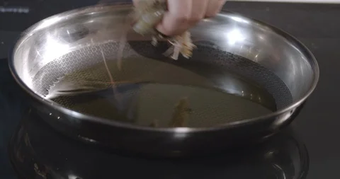 Chef prepares fried shrimp in a pan. Seafood Preparation. Stock Footage 124008033