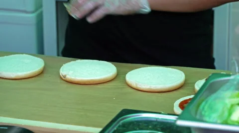 Chef prepares hamburger buns  Stock Footage 65681907