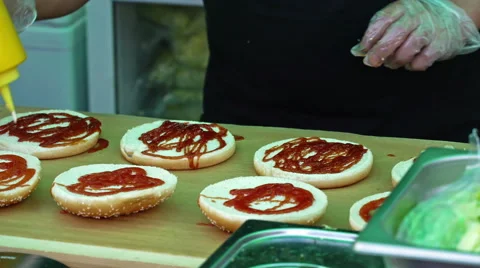 Chef prepares hamburger buns Stock Footage 65683360