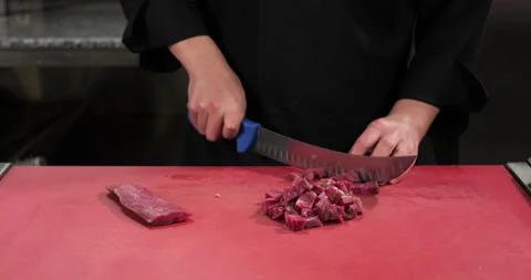 Chef prepares healthy meal, cuts raw meat bon fillet with a knife. Healthy Stock Footage 292765804
