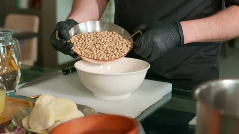 The chef prepares the hummus Stock Footage 136998501