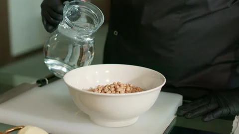 The chef prepares the hummus Stock Footage 136998561