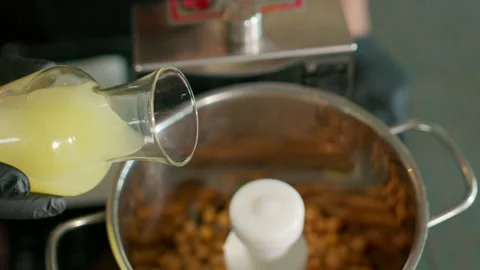The chef prepares the hummus Stock Footage 136999204