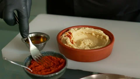 The chef prepares the hummus Stock Footage 136999557