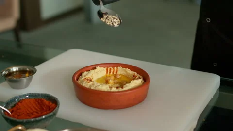 The chef prepares the hummus Stock Footage 136999625