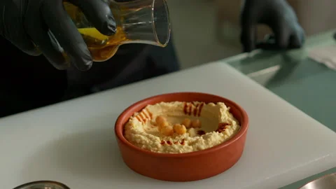 The chef prepares the hummus Stock Footage 136999632