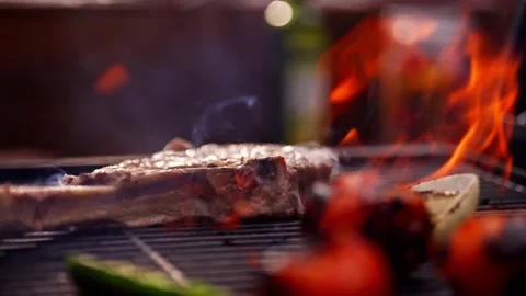 Chef Prepares Large Bone-in Ribeye Tomahawk Steak On Fire Grill Stock Footage 288038751