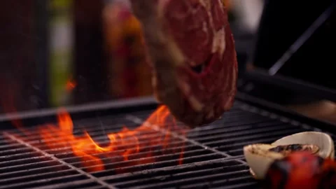 Chef Prepares Large Bone-in Ribeye Tomahawk Steak On Fire Grill Stock Footage 288038758