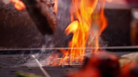 Chef Prepares Large Bone-in Ribeye Tomahawk Steak On Fire Grill Stock Footage 288038759