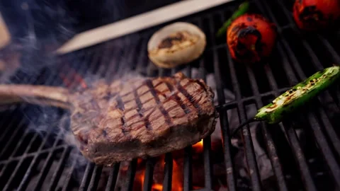 Chef Prepares Large Bone-in Ribeye Tomahawk Steak On Fire Grill Stock Footage 288038765