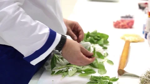 Chef prepares leaves for salad Stock Footage 76876728