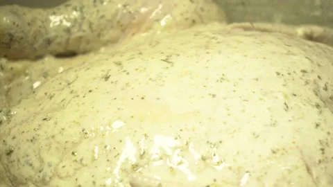 Chef prepares marinade and stirs raw chicken legs for barbecue or frying in deep Stock Footage 138896545