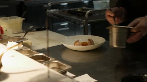 The chef prepares meals in the restaurant Stock Footage 286843274