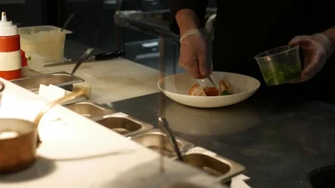 The chef prepares meals in the restaurant Stock Footage 286843334