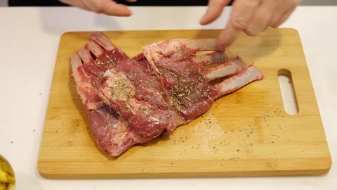 The chef prepares the meat for the barbecue, making sure every piece of meat is Stock Footage 270442754